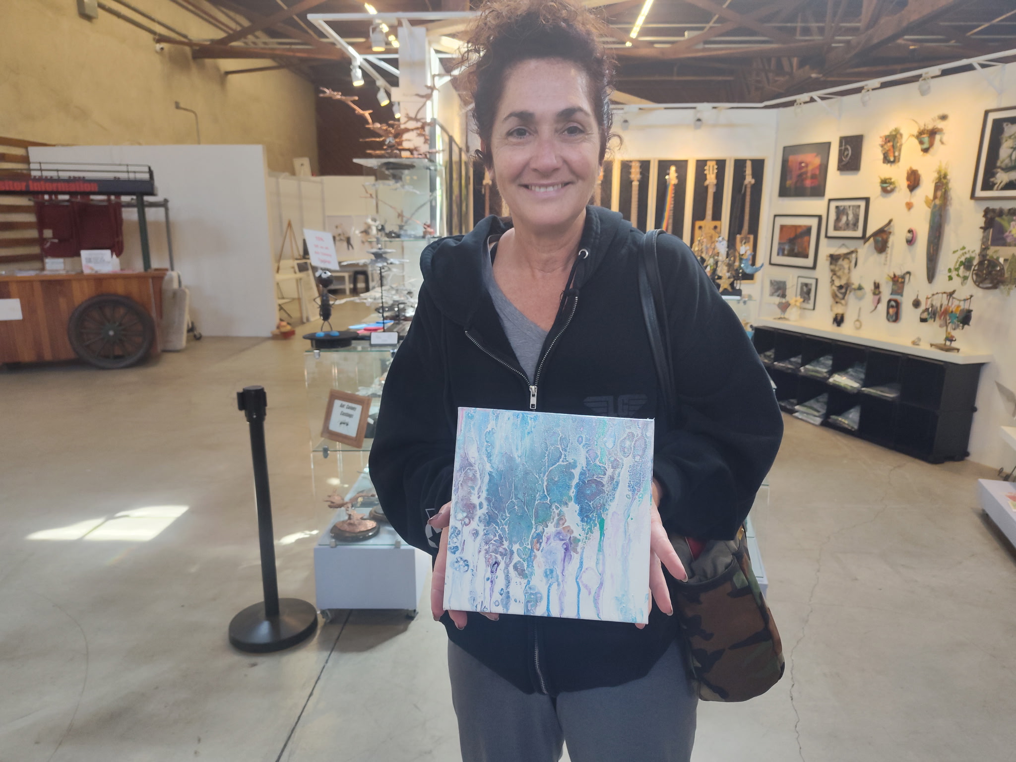 Person holding painting