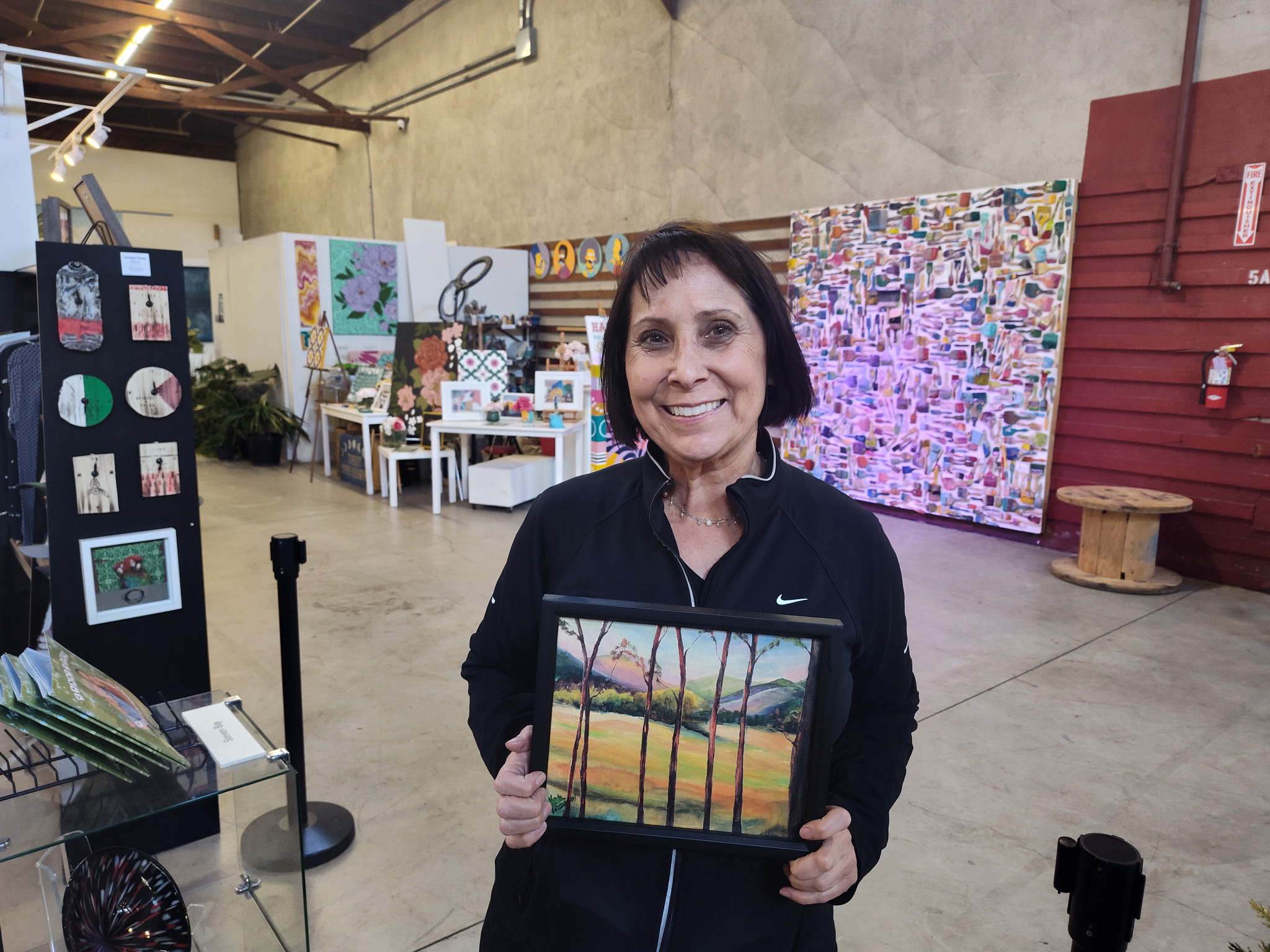 Person holding painting