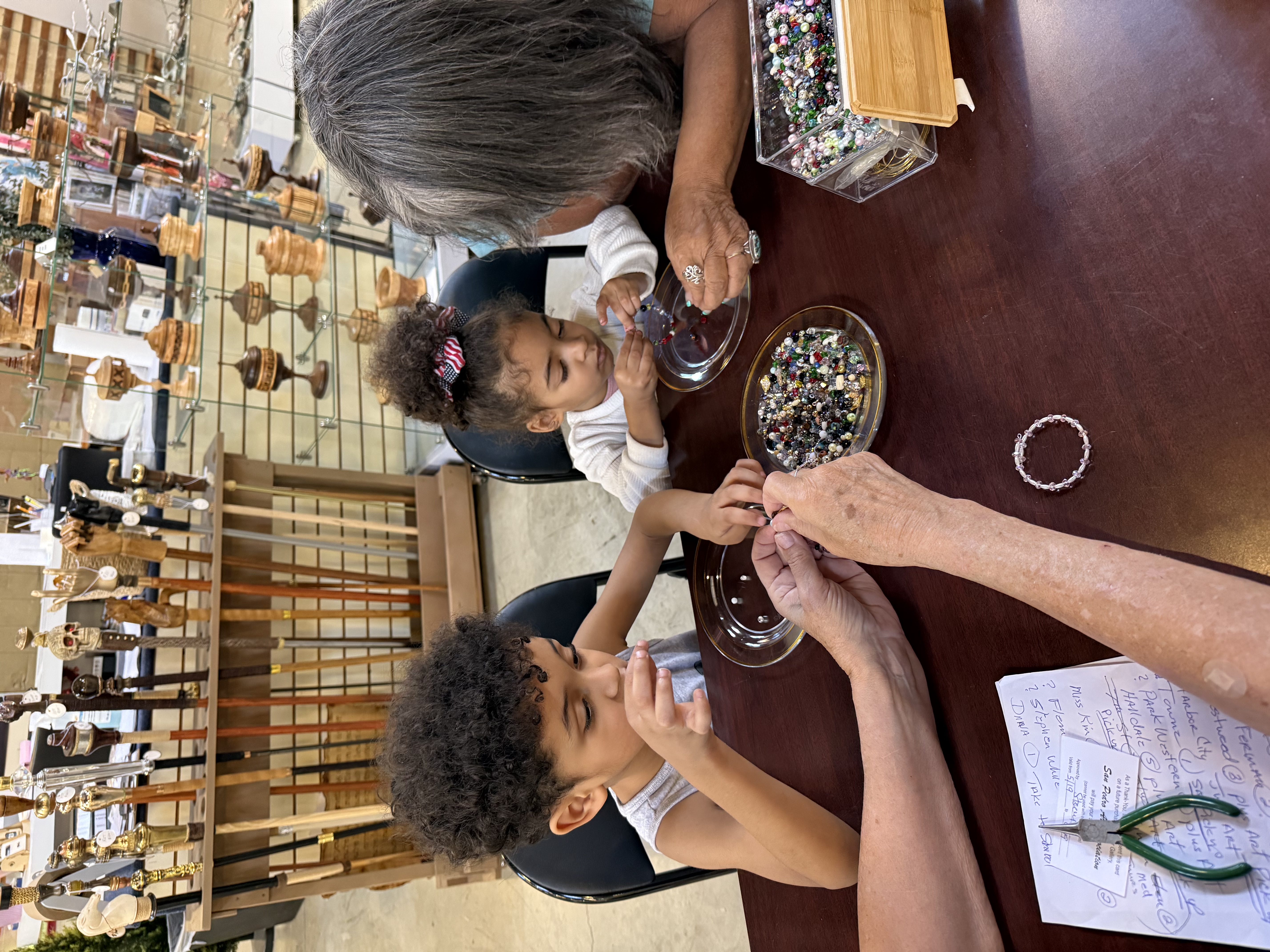 Child making jewelry