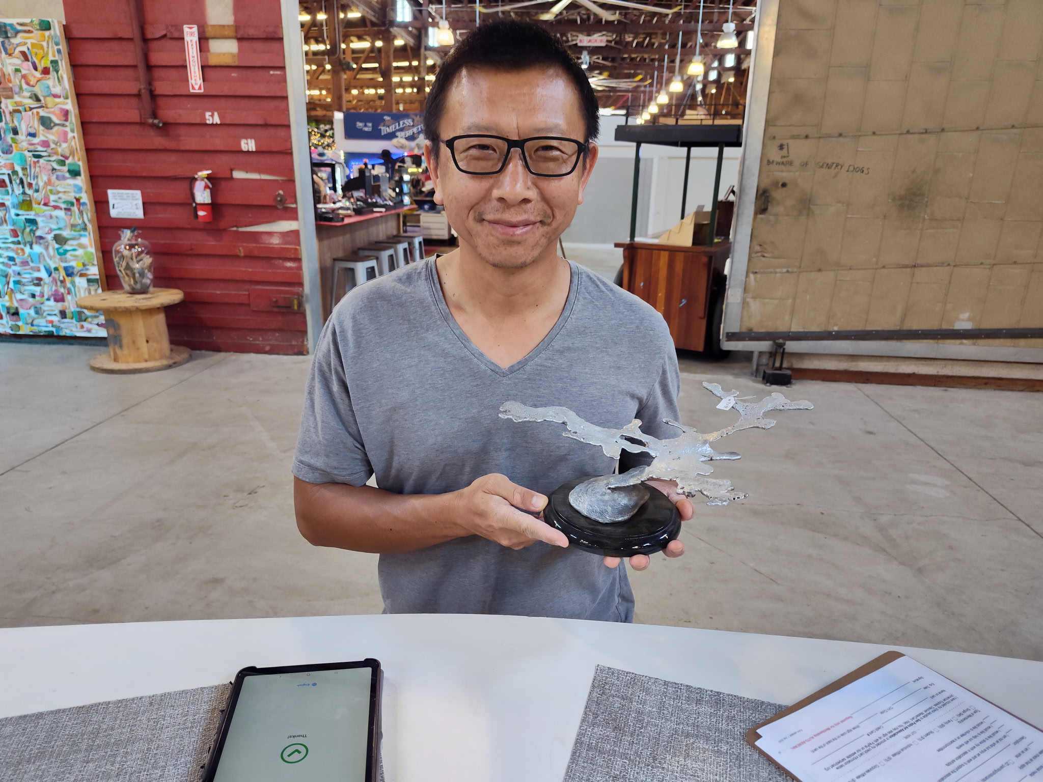 Person holding sculpture