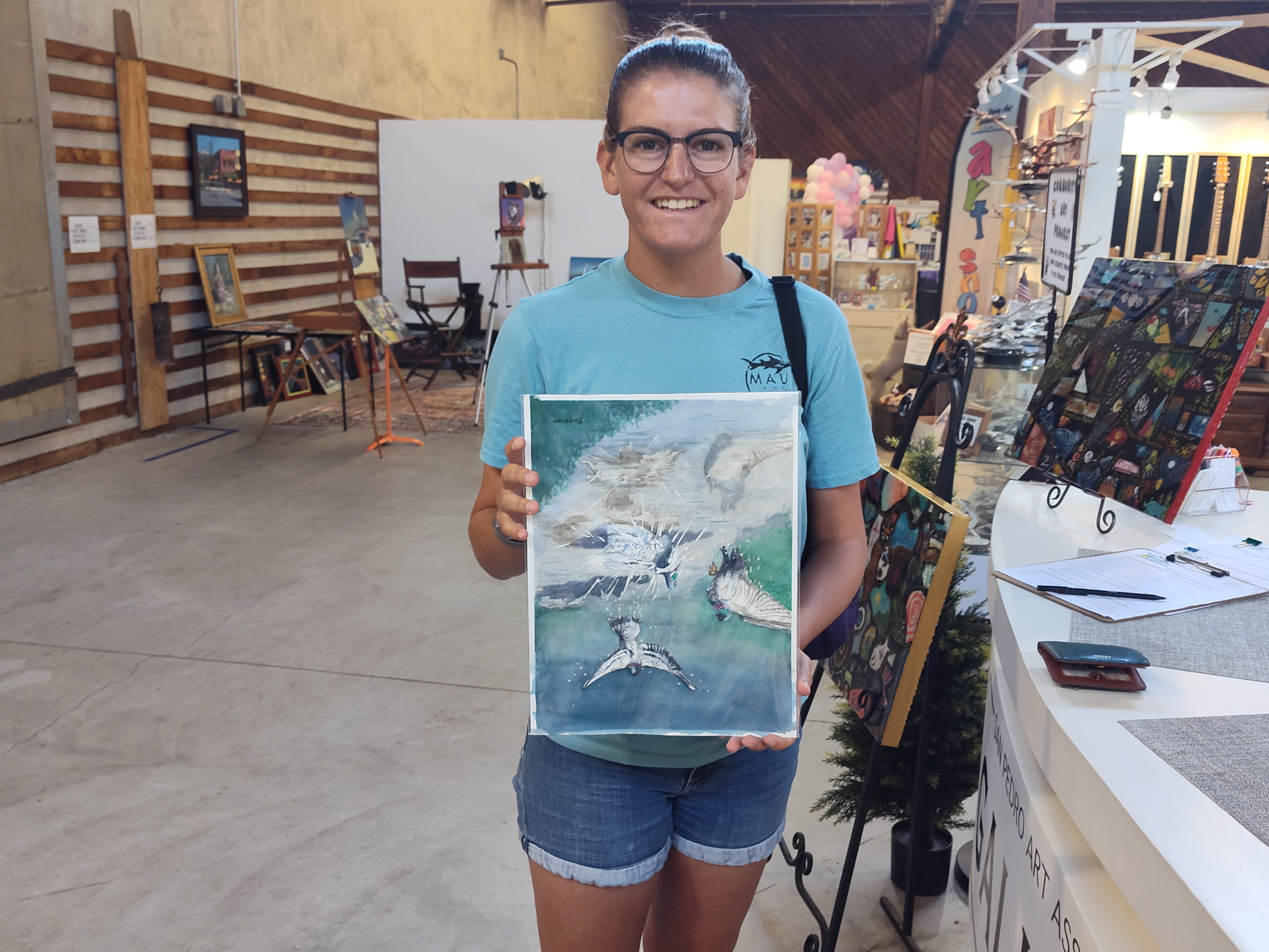 Person holding painting