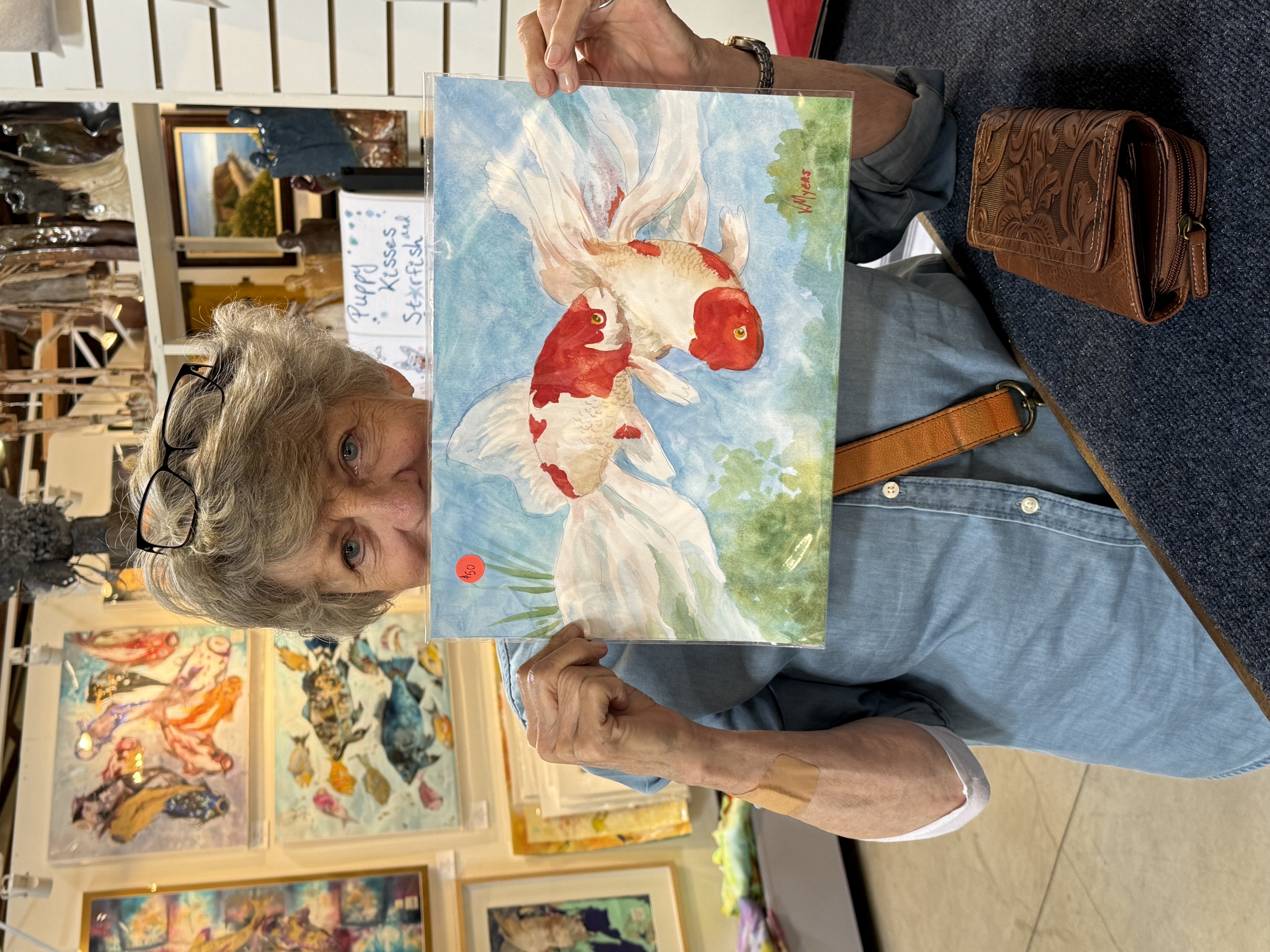 Person holding painting