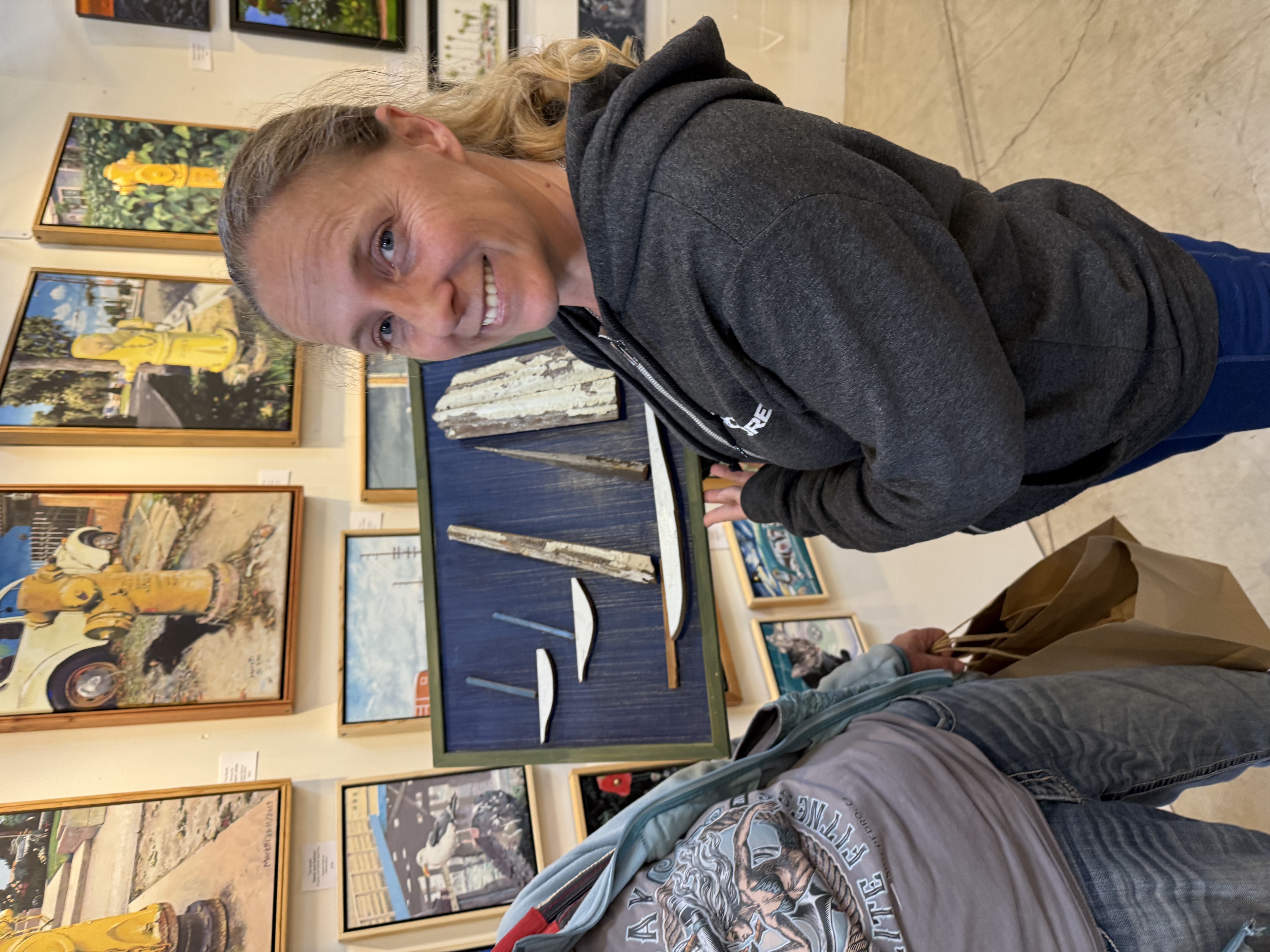 Person holding painting